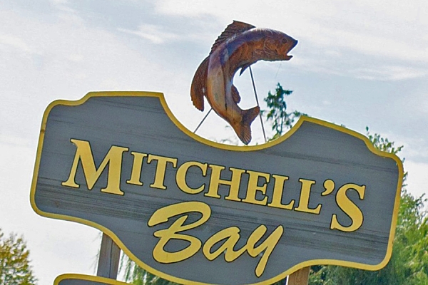 sign welcoming visitors to Mitchell’s Bay