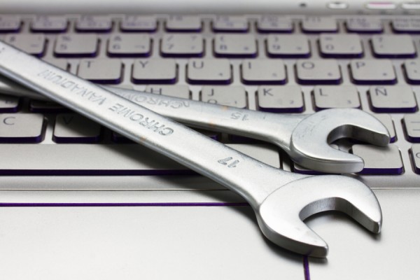 Wrenches on computer keyboard