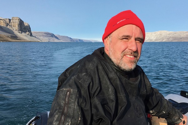 Nigel Hussey in boat in Arctic waters