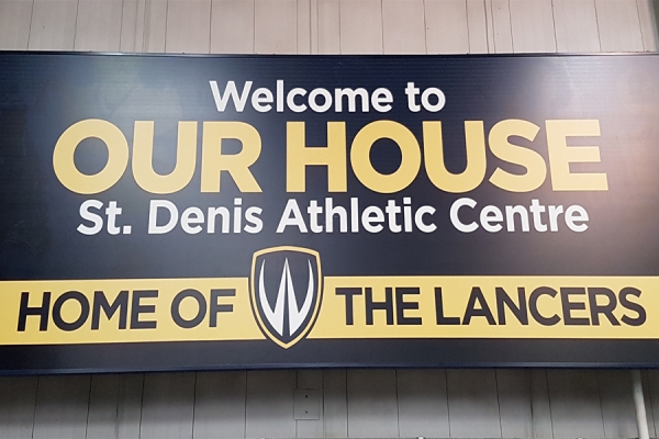 Sign reading &quot;Our House: Home of the Lancers&quot;