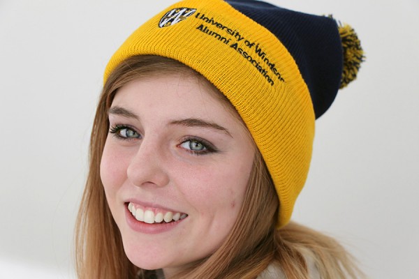 Drama student Paige Romberg models an alumni toque like the one offered in today’s DailyNews quiz contest.