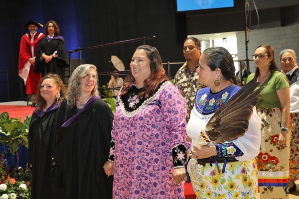 Stephanie Esentsei Pangowish on Convocation stage