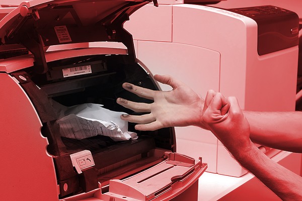 printer jam spilling toner onto person&#039;s hands