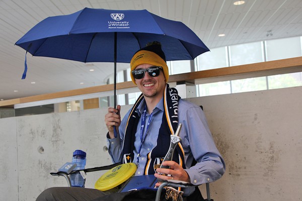 Rob Janisse models some of the swag at stake in the alumni field goal contest.