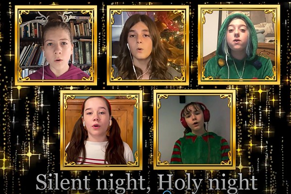 Screen of children singing &quot;Silent Night&quot;