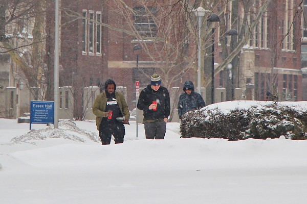 students walking in heavy snow