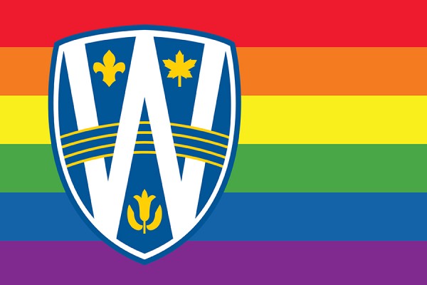 UWindsor logo shield over rainbow flag