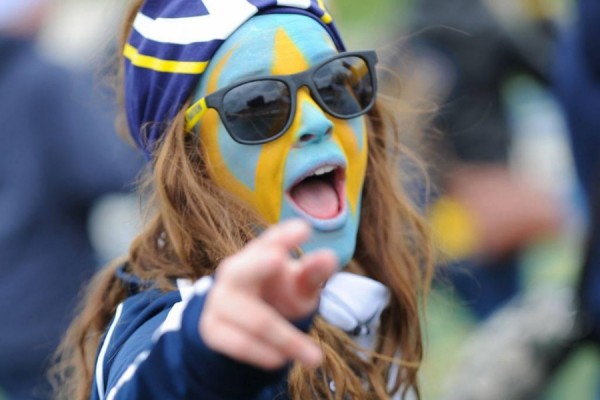 Student with face painted in blue and gold