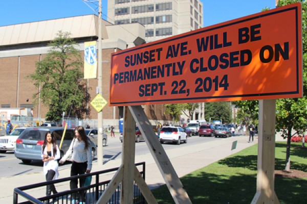 Sign announcing the pending closure of Sunset Avenue between Wyandotte and University streets.