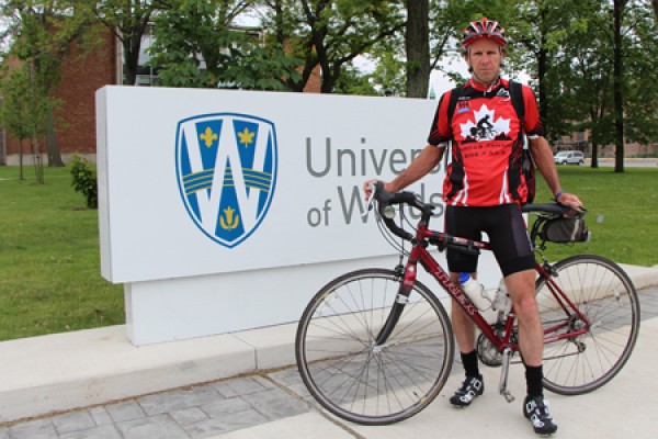 Brian Belanger posing with bicycle