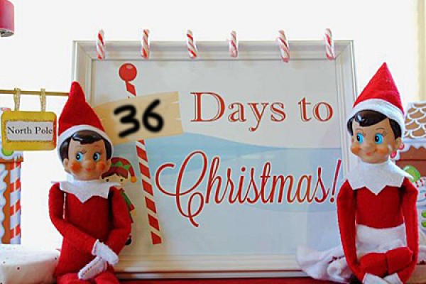 elves under sign &quot;36 days til Christmas&quot;