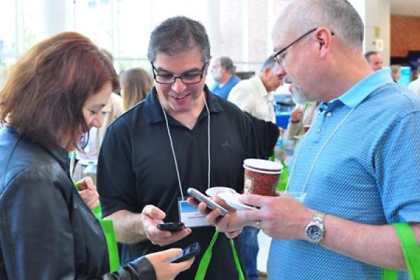 Ramona Codreanu, Domenic Panetta and Noah Diesbourg explore smartphone functionality during a break in Campus Technology Day 2014.