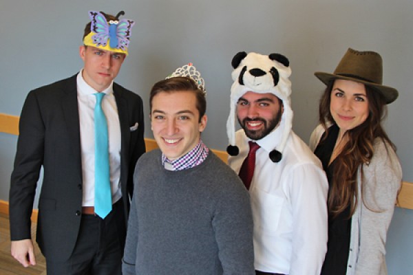 MBA students Connor Paterson, Michael Ruffolo, Tyler Jahn and Jessica O’Kane wearing silly hats.