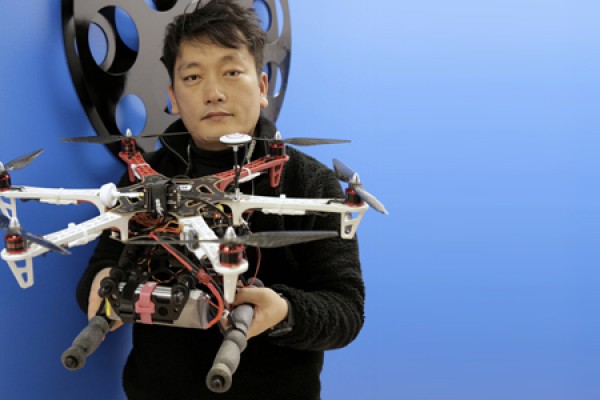 Min Bae holding drone