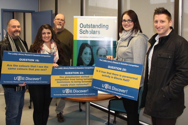 Organizers congratulate the winners of the Leddy Library Research Question Competition