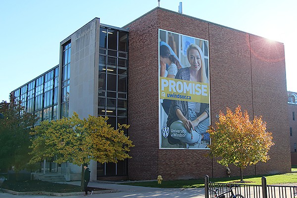 Essex Hall bearing large sign with slogan Promise