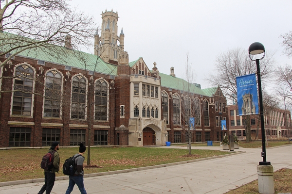 students walk in front of Dillon Hall