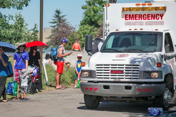 An emergency vehicle is set up as a cooling station during a June 30 heatwave in Calgary.