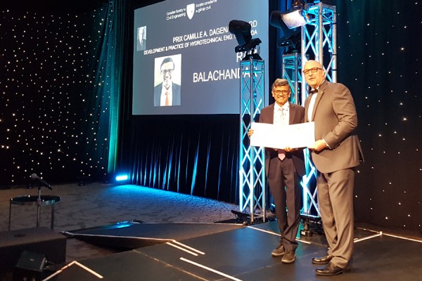 Ram Balachandar (left) accepts the Camille A. Dagenais Award