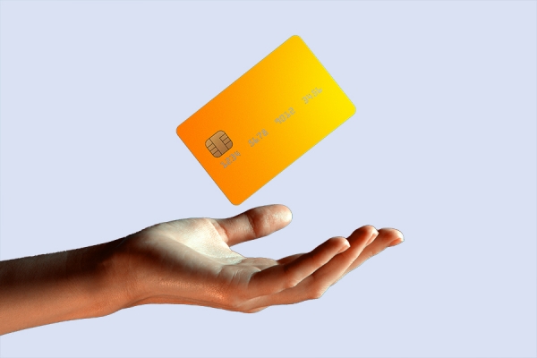 hand raising credit card