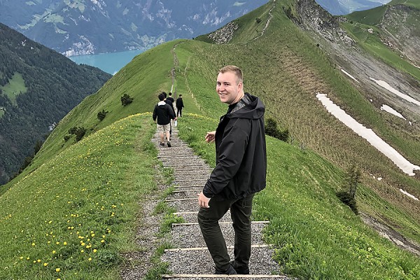 Lucas Dodson walking along mountain path