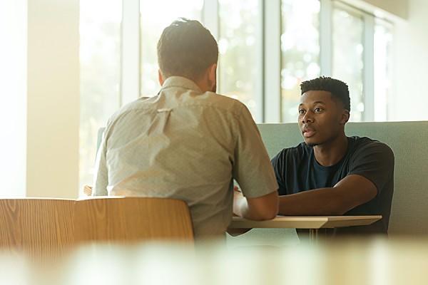 two people in conversation