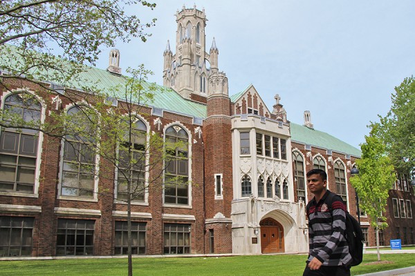 student walking by Dillon Hall