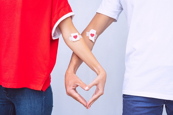 holding hands shaped like heart