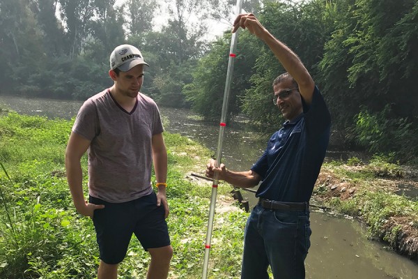 Dylan Verburg, a master’s candidate in environmental engineering, and professor Rajesh Seth work to improve drinking water quality in the capital of India.