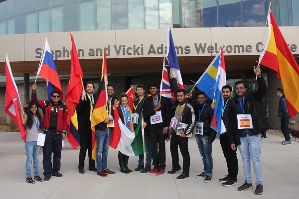 Flag bearers pose outside Welcome Centre