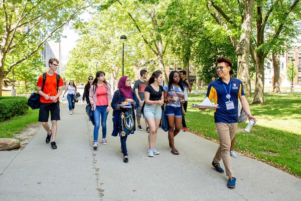 student leading campus tour