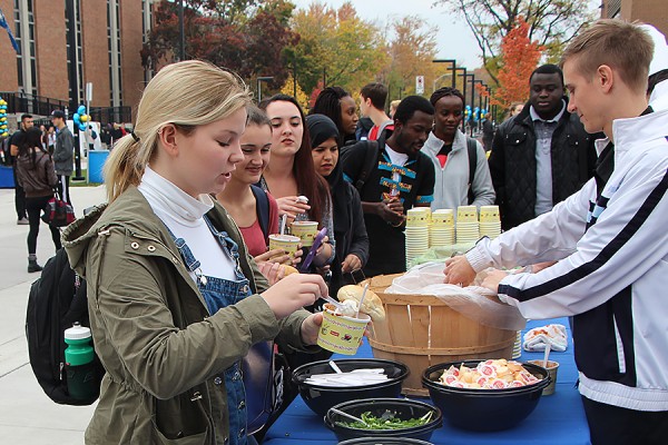 Jaime Nantais adds a dollop of sour cream to her veggie chili.