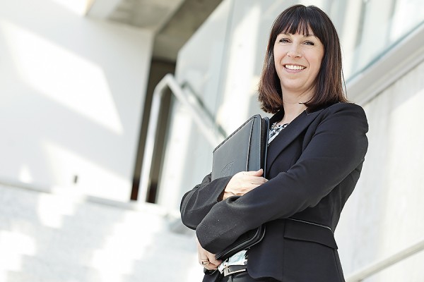 Woman holding portfolio proudly