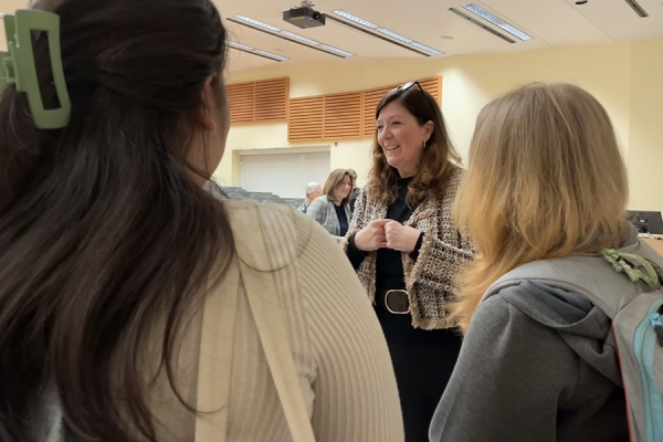 Katherine Henderson speaking with students