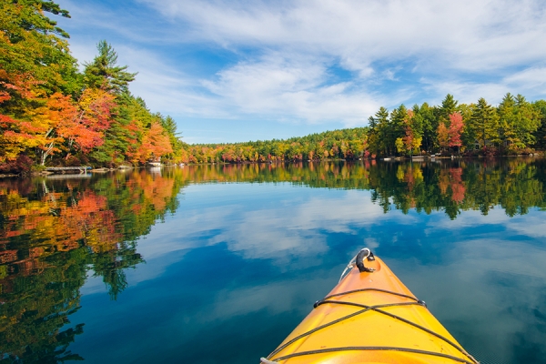 Kayak crossing calm lake