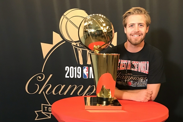 Keifer Bell with NBA championshiop trophy