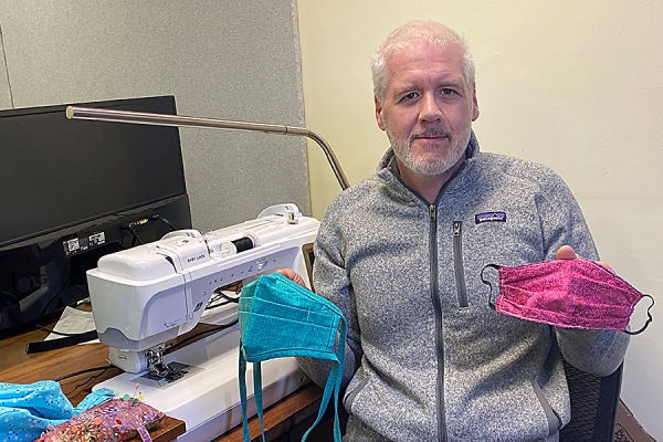 UWindsor professor Ken Drouillard holding masks