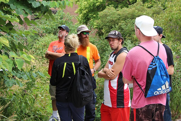 UWindsor gardener Aaron Dickau shows St. Clair College horticulture students and instructors the diversity of native species in the Stewart Moore Carolinian Garden.
