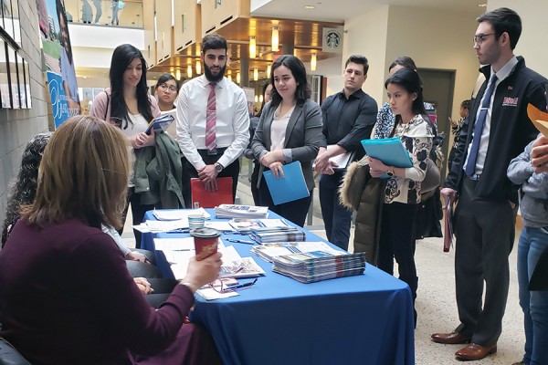 Nursing Career Fair - students gather around potential emploer&#039;s table