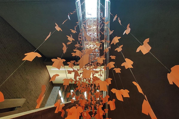 orange paper shirts hanging toward sky