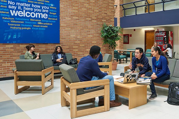 students sitting in residence common room