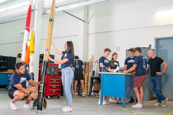students building rocket