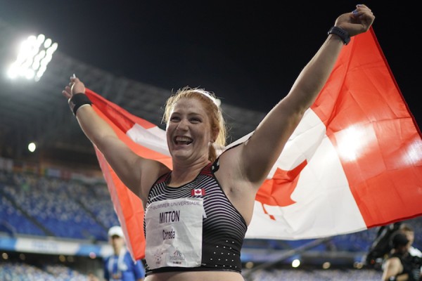 Sarah Mitton carrying Canadian flag