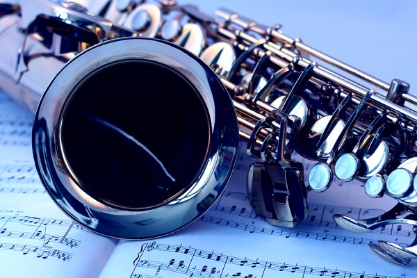 saxophone lying on sheet music