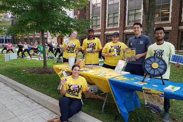 Student volunteers distribute literature on suicide prevention outside Dillon Hall.