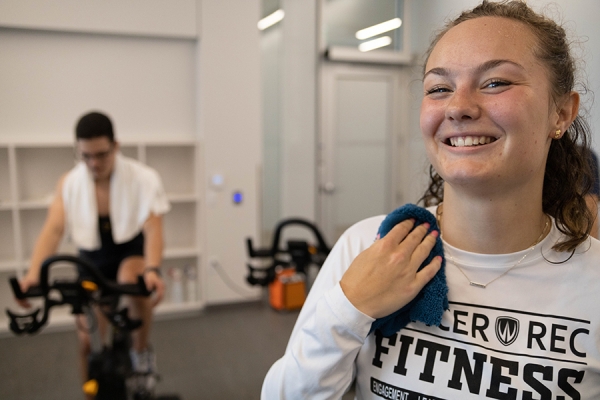 students in spin class on stationary bicycles