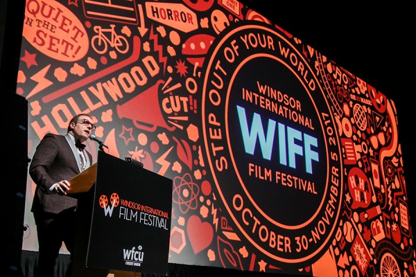 Vincent Georgie in front of screen at Windsor International Film Festival