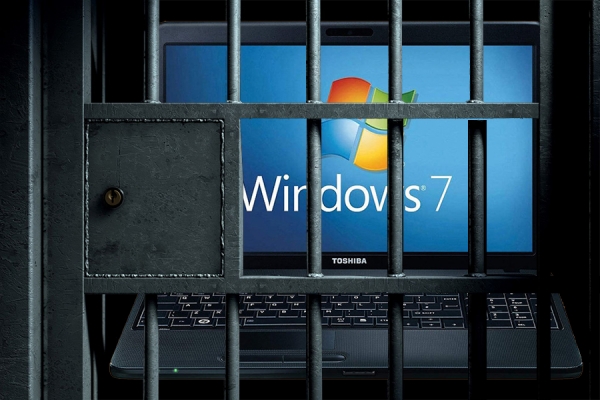 A Windows computer behind bars, as if in jail.