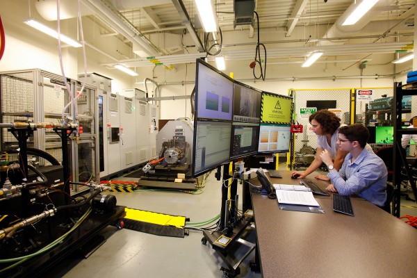 Researchers in UWindsor’s Centre for Hybrid Automotive Research and Green Energy work on a state-of-the-art EV electric motor test system.