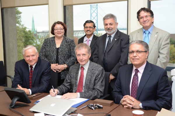 officials gathered for signing